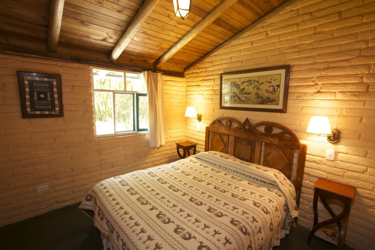 אוטהוואלו Las Palmeras Inn חדר תמונה
